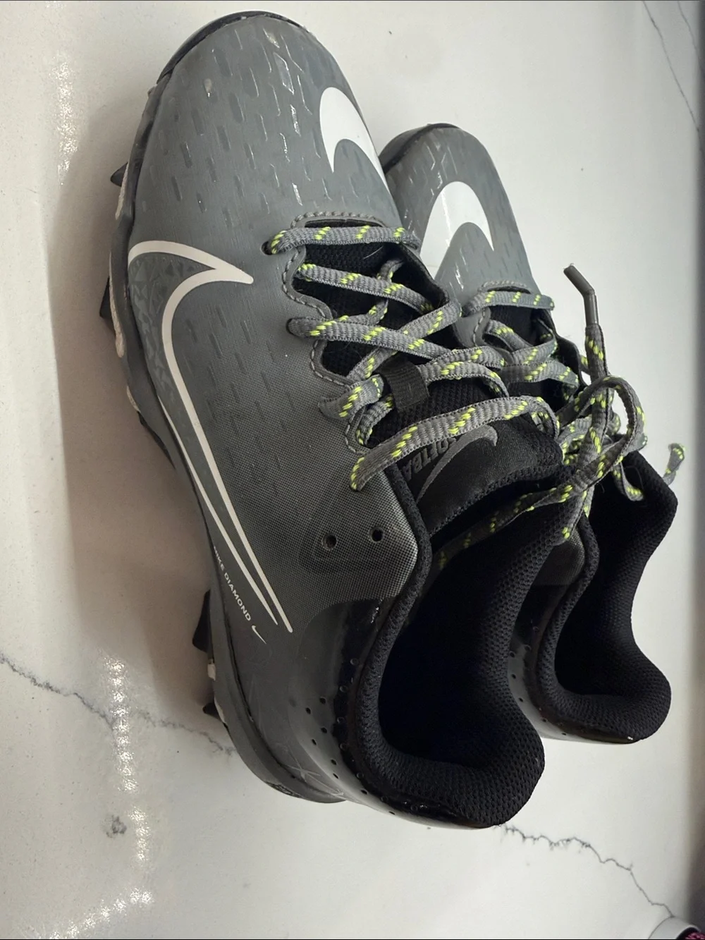 Nike Gray Cleats with White Swoosh and Neon-Lime Accents
